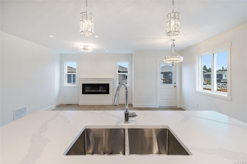 6268 Old Mill Rd, Duncan, BC - Indoor Photo Showing Kitchen With Fireplace