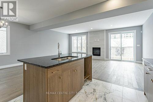 1596 Noah Bend, London North (North I), ON - Indoor Photo Showing Kitchen With Fireplace With Double Sink
