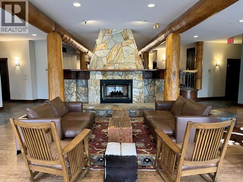 5258 Highline Drive Unit# 122, Fernie, BC - Indoor Photo Showing Other Room With Fireplace