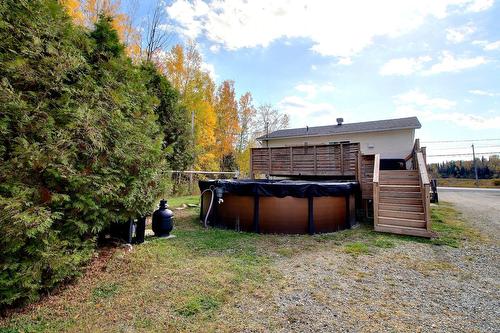 Back facade - 2282 Route De St-Philippe, Val-D'Or, QC - Outdoor With Above Ground Pool