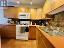 800 Mackenzie Avenue Unit# 102, Revelstoke, BC  - Indoor Photo Showing Kitchen With Double Sink 