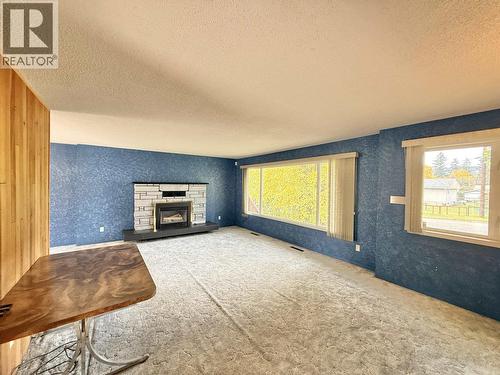768 Vaughan Street, Quesnel, BC - Indoor Photo Showing Living Room With Fireplace