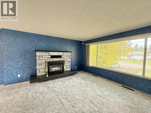 768 Vaughan Street, Quesnel, BC - Indoor Photo Showing Living Room With Fireplace