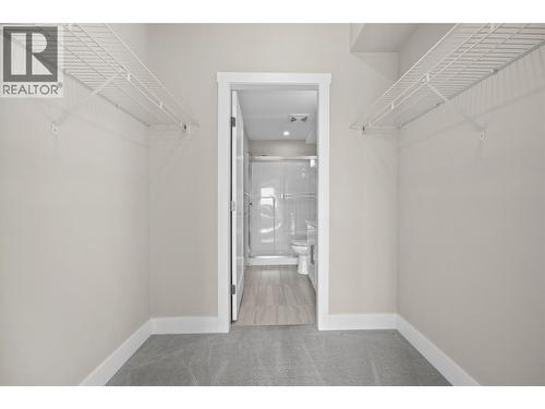 Primary Bedroom Closet + Ensuite - 3090 Burtch Road Unit# 313, Kelowna, BC - Indoor Photo Showing Other Room