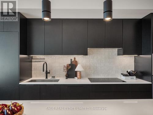 Sleek black kitchen design - Ph 621 - 899 College Street W, Toronto, ON - Indoor Photo Showing Kitchen