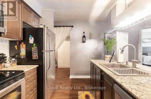 104 - 1 Brandy Lane Drive, Collingwood, ON - Indoor Photo Showing Kitchen With Double Sink With Upgraded Kitchen