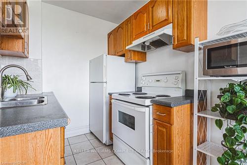 606 - 101 Queen Street S, Hamilton, ON - Indoor Photo Showing Kitchen With Double Sink