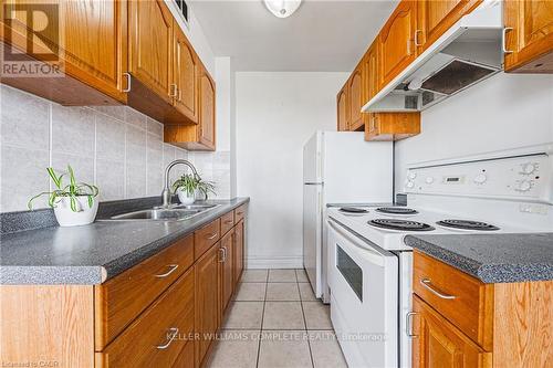 606 - 101 Queen Street S, Hamilton, ON - Indoor Photo Showing Kitchen With Double Sink