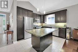 kitchen with snack-at island overlooks the . . . - 