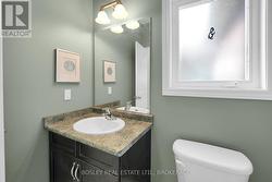 Conveniently located off the hall is the powder rm - 