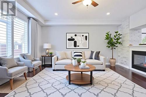 Virtually Staged Option - 63 The Queensway, Barrie, ON - Indoor Photo Showing Living Room With Fireplace