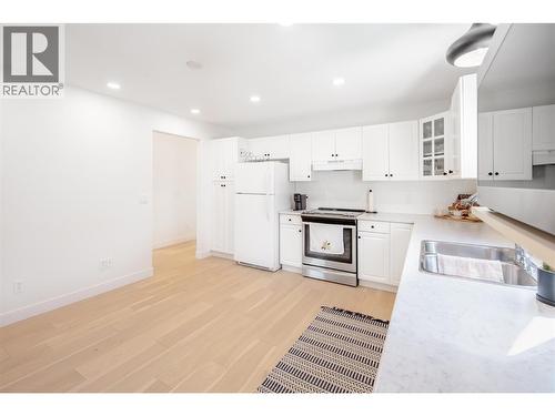 650 Lexington Drive Unit# 310, Kelowna, BC - Indoor Photo Showing Kitchen With Double Sink