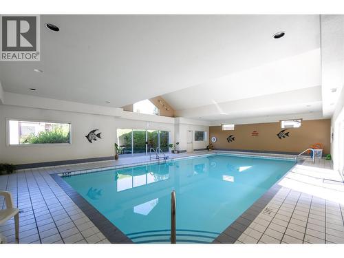 650 Lexington Drive Unit# 310, Kelowna, BC - Indoor Photo Showing Other Room With In Ground Pool