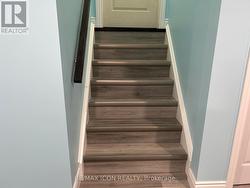 Stairs to the upper level. - 