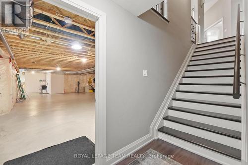 Extra wide hardwood stairs to Lower Level. - 217 Shamus Way, Ottawa, ON - Indoor Photo Showing Other Room