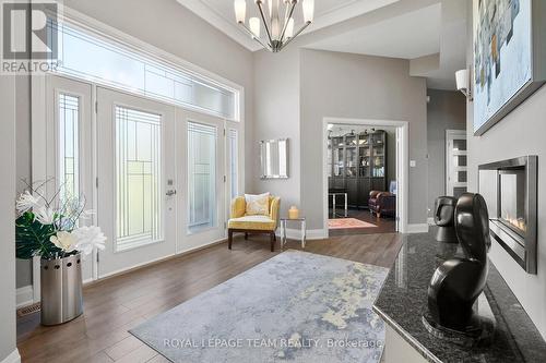 Grand Foyer w/dbl sided fireplace & crown molding. - 217 Shamus Way, Ottawa, ON - Indoor