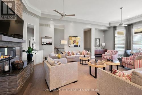 Dbl sided gas fireplace in large LR w/pot lights. - 217 Shamus Way, Ottawa, ON - Indoor Photo Showing Living Room With Fireplace