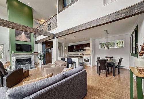 Salon - 2705 Route 323 N., Amherst, QC - Indoor Photo Showing Living Room With Fireplace