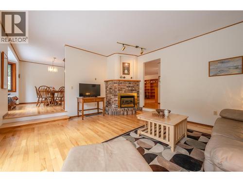 8015 Victoria Road S, Summerland, BC - Indoor Photo Showing Living Room With Fireplace