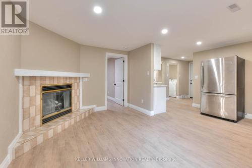 Lower - 170 Wheatfield Crescent, Kitchener, ON - Indoor Photo Showing Living Room With Fireplace