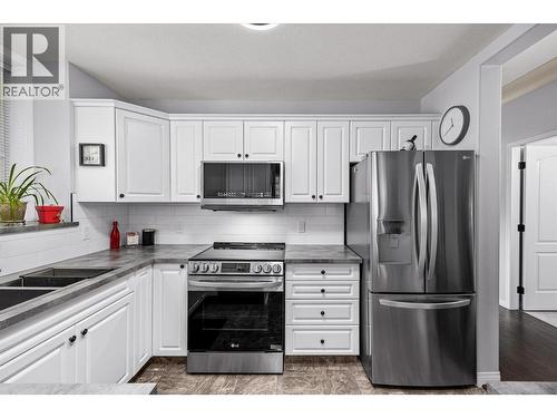 1964 Enterprise Way Unit# 115, Kelowna, BC - Indoor Photo Showing Kitchen With Double Sink