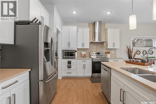 303 Dagnone Crescent, Saskatoon, SK - Indoor Photo Showing Kitchen With Stainless Steel Kitchen With Double Sink