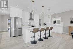 SS appliances & large island in eat-in Kitchen. - 