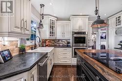 B/I wall ovens, new dishwasher, island cooktop - 