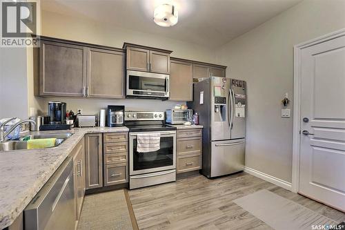 430 3630 Haughton Road E, Regina, SK - Indoor Photo Showing Kitchen With Stainless Steel Kitchen With Double Sink
