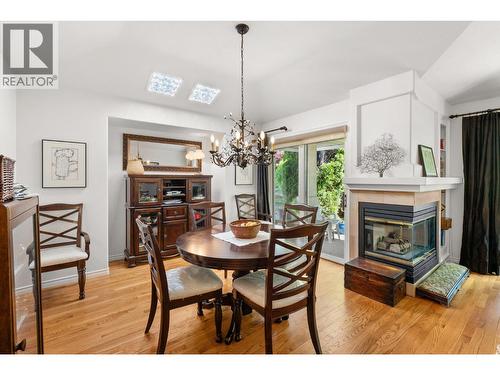 3889 Gallaghers Grange, Kelowna, BC - Indoor Photo Showing Dining Room With Fireplace