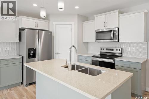2925 Welby Way, Regina, SK - Indoor Photo Showing Kitchen With Double Sink With Upgraded Kitchen