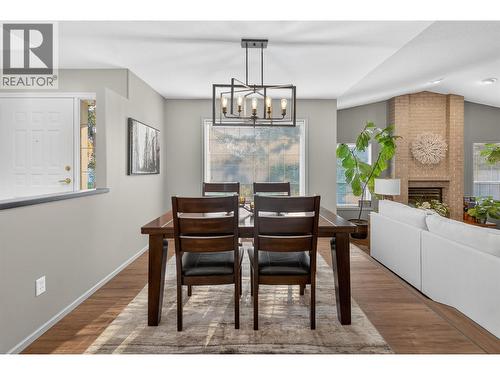 2330 Butt Road Unit# 407, West Kelowna, BC - Indoor Photo Showing Dining Room With Fireplace