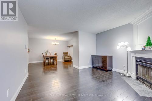 911 - 1450 Glen Abbey Gate, Oakville, ON - Indoor Photo Showing Living Room With Fireplace