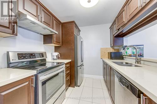 911 - 1450 Glen Abbey Gate, Oakville, ON - Indoor Photo Showing Kitchen With Double Sink