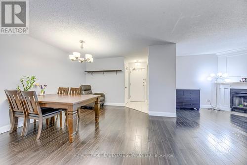 911 - 1450 Glen Abbey Gate, Oakville, ON - Indoor With Fireplace