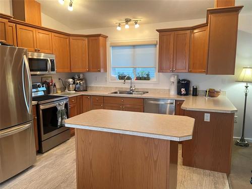 93 Eagle Way, Brandon, MB - Indoor Photo Showing Kitchen With Double Sink