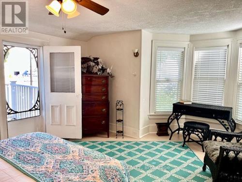 front bedroom 1 with balcony overlooking the canal - 62 West Street, Port Colborne (Sugarloaf), ON - Indoor Photo Showing Bedroom