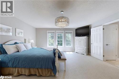 Bedroom featuring a textured ceiling and carpet - 4905 First Line, Erin, ON - Indoor Photo Showing Bedroom