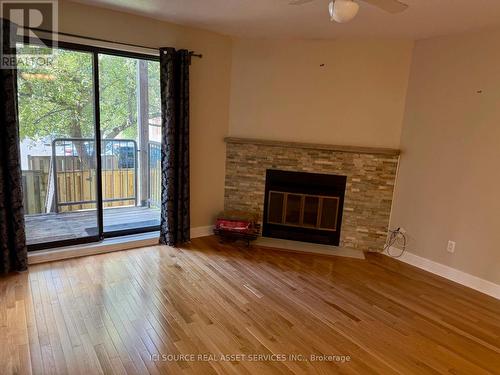 8 Blue Moon Private, Ottawa, ON - Indoor Photo Showing Living Room With Fireplace