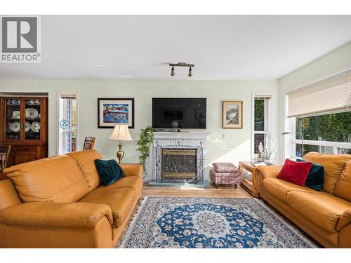 1160 Kneller Court, Kelowna, BC - Indoor Photo Showing Living Room With Fireplace