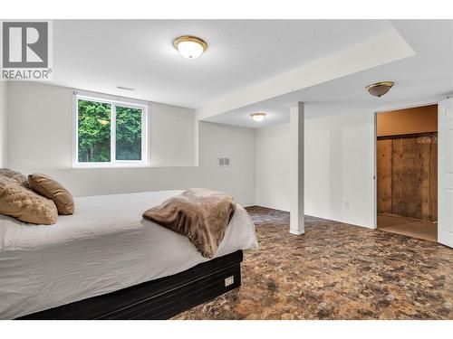 Oversized 5th bedroom with storage - downstairs. - 2241 Majoros Road, West Kelowna, BC - Indoor Photo Showing Bedroom