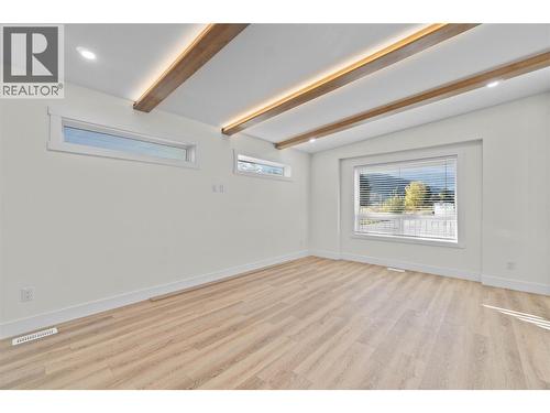 Living Area, faux beams, lit up - 730 Elderberry Walk, Sicamous, BC 