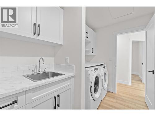 Laundry room, appliances, extra tub, storage - 730 Elderberry Walk, Sicamous, BC 