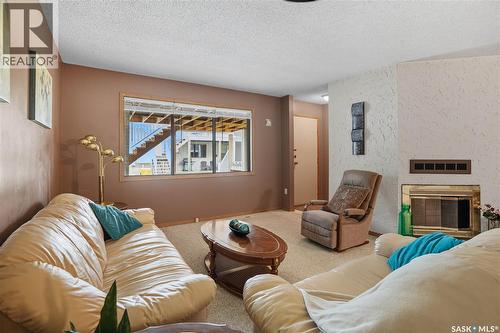 6934 Blakeney Drive, Regina, SK - Indoor Photo Showing Living Room With Fireplace