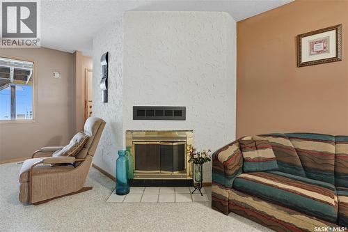 6934 Blakeney Drive, Regina, SK - Indoor Photo Showing Other Room With Fireplace