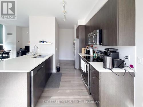 Ph06 - 339 Rathburn Road W, Mississauga, ON - Indoor Photo Showing Kitchen With Double Sink