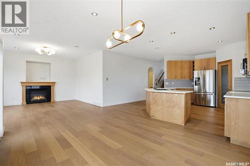 2106 Laurier Crescent E, Regina, SK - Indoor Photo Showing Kitchen With Fireplace With Stainless Steel Kitchen