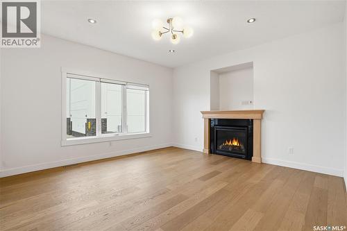 2106 Laurier Crescent E, Regina, SK - Indoor Photo Showing Living Room With Fireplace