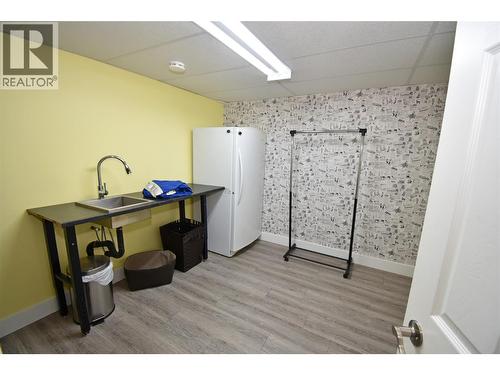 Spacious laundry room with a sink - 6427 Spencer Road, Kelowna, BC - Indoor Photo Showing Other Room