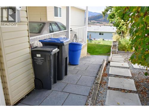 Side of home to lower back yard - 6427 Spencer Road, Kelowna, BC - Outdoor With Exterior